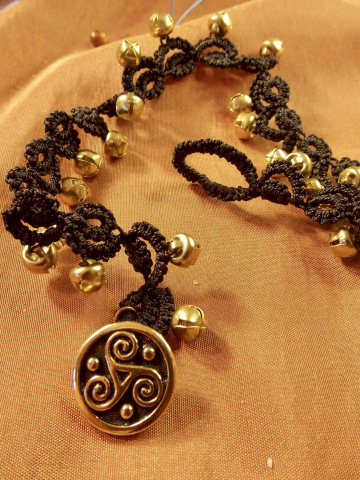 Black tatted lace anklet with golden bells and triskele clasp.