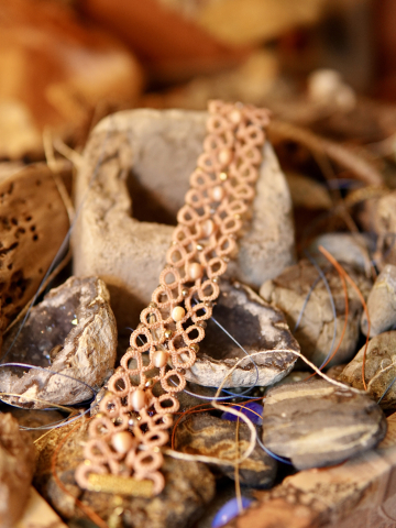 Emberclay tatted lace bracelet on bohemian backdrop with crystals and cement