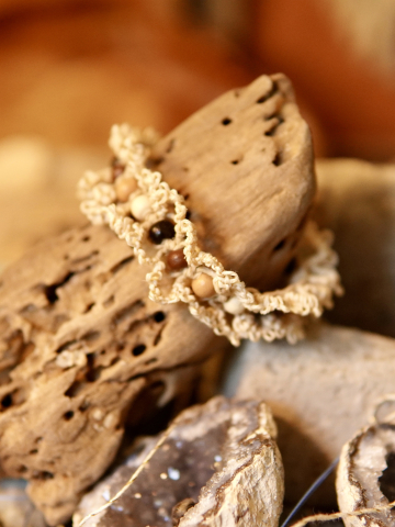 Earth-toned bracelet photgraphed in natural light on wood.