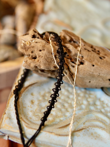 Hand-tatted thread bracelet expressing bond and presence.
