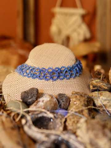 Skyweft tatted lace choker against a bohemian backdrop.