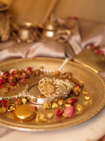 Nature-inspired lace pin with heron cameo in warm vintage light