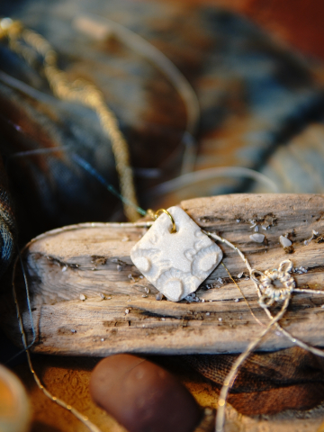 Ivory clay diamond pendant