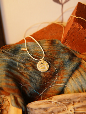 Gold rubbed lace necklace