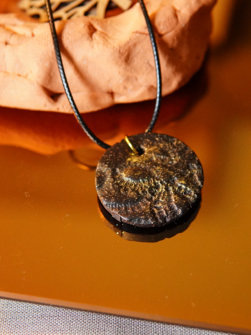 Black clay necklace with gold accents