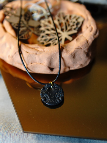 Black clay necklace with silver flecks