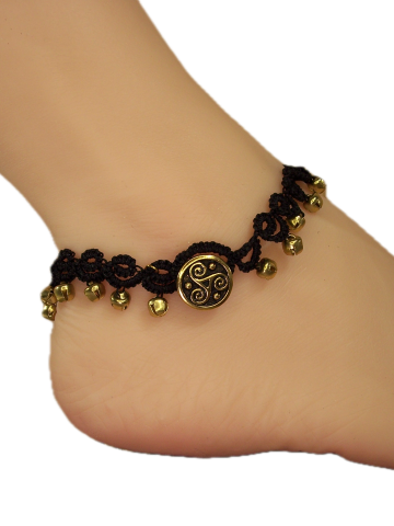 Handmade lace anklet featuring gold bells and Celtic button.