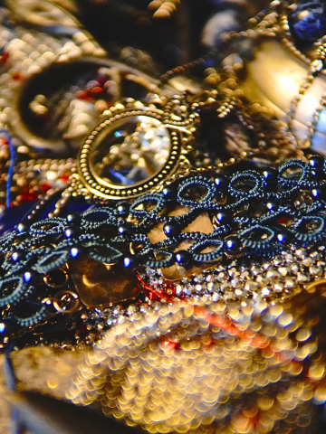 Dusky blue lace choker displayed on metal surface