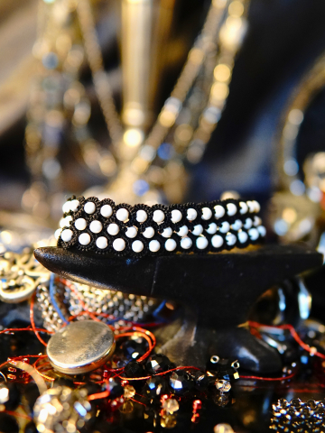 Black tatted bracelet with pale stone beads