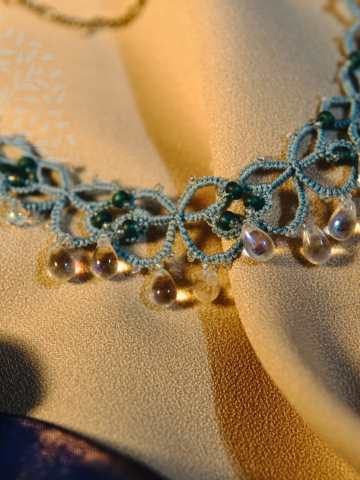 Ocean-inspired jewelry featuring glass teardrops and sea-blue lace.