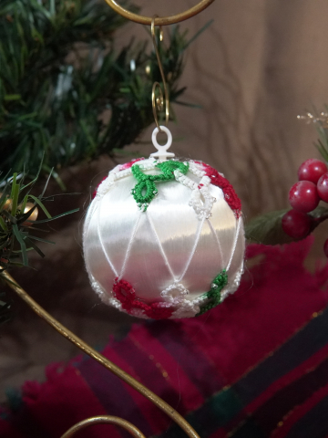 Christmas satin ball decorated with handcrafted tatting and lattice design