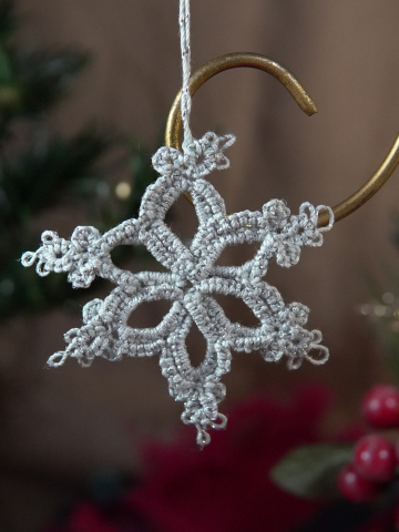 Hand-tatted small silver snowflake ornament with lace loops