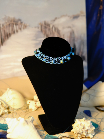 Ocean-inspired lace choker with ceramic accents and Celtic clasp.