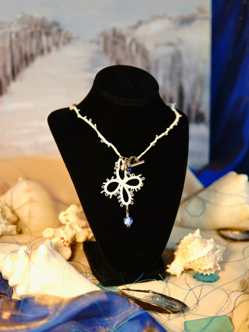 Tidecross lace necklace with ocean blue glass bead accents