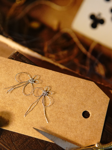 Metallic tatted butterflies on a kraft tag